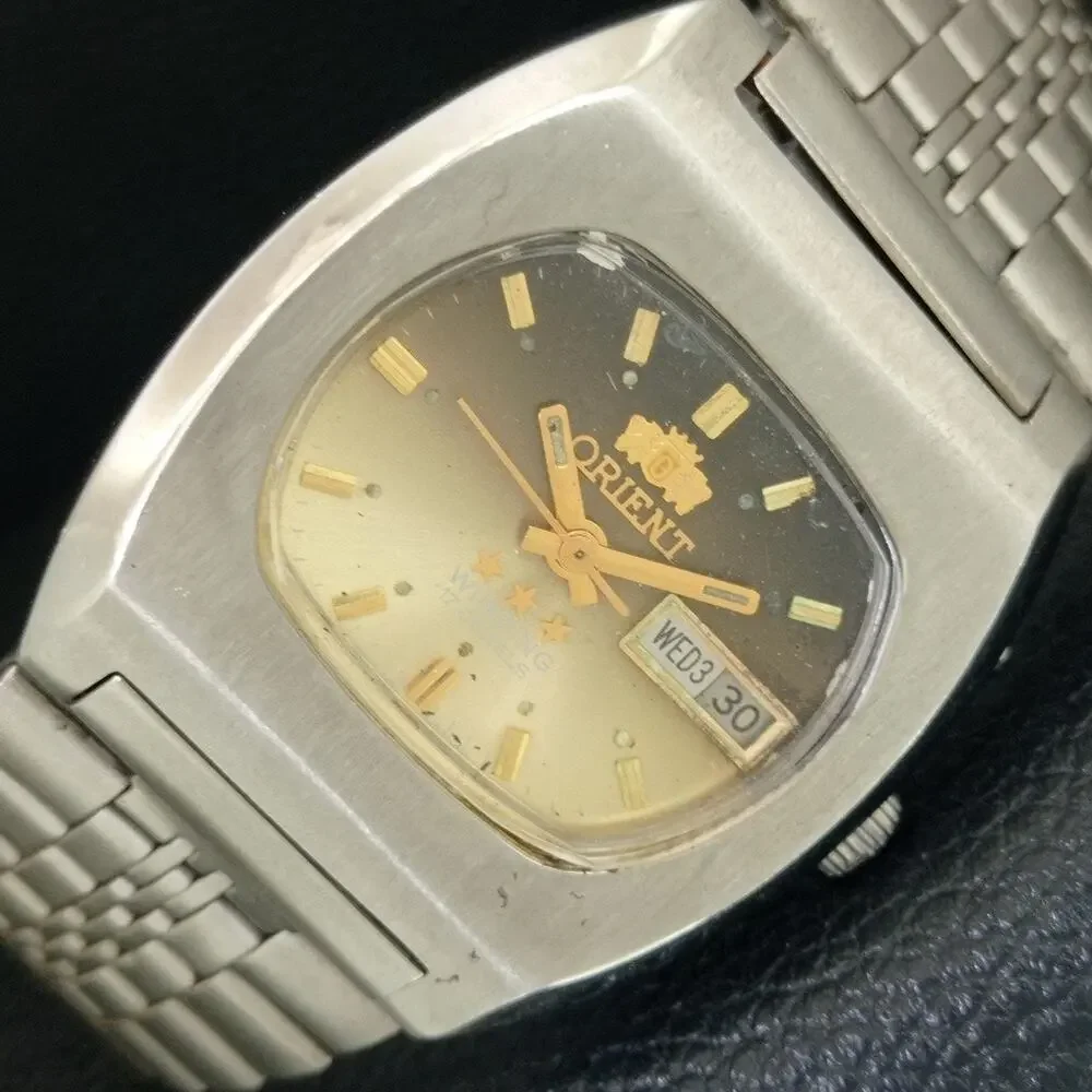 Vintage 1973 Orient Manual Mens Silver Watch W/daydate & Gold accents